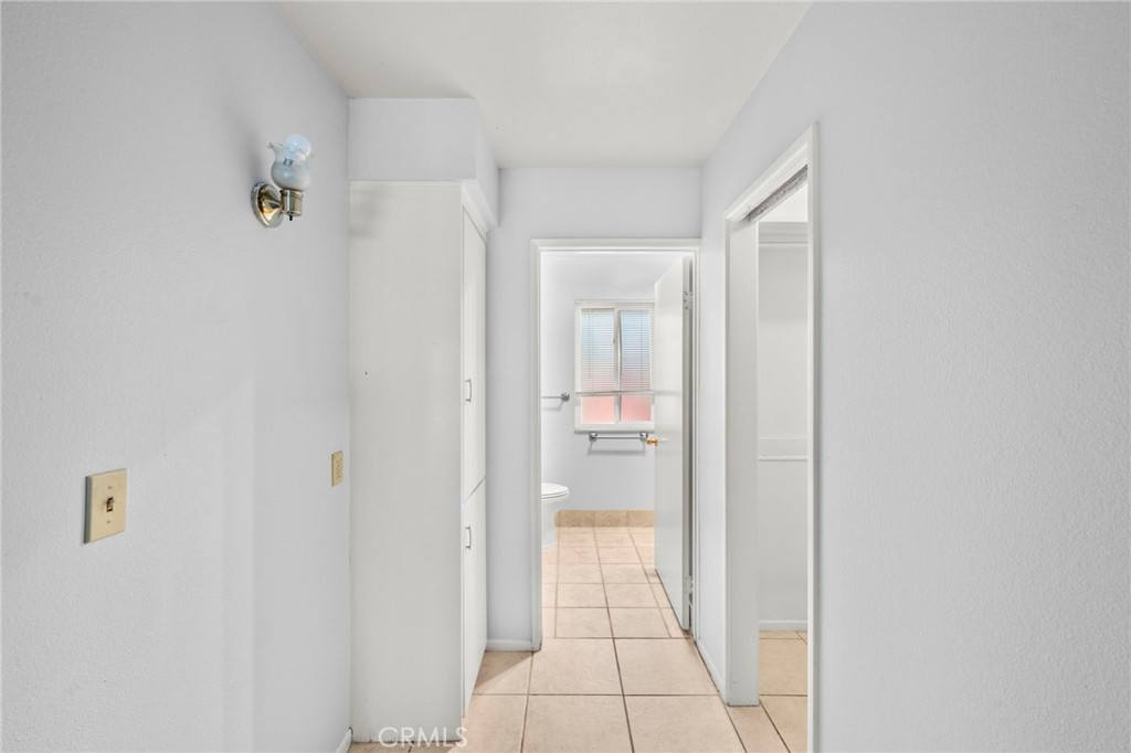 25915 Roanoke Road Menifee, CA 92586 - Photo 30 of 58 a bathroom with a glass shower door
