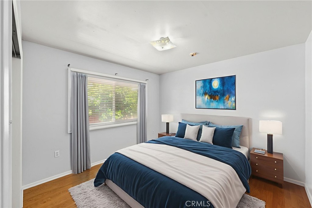 25915 Roanoke Road Menifee, CA 92586 - Photo 34 of 58 a bedroom with a bed and a window