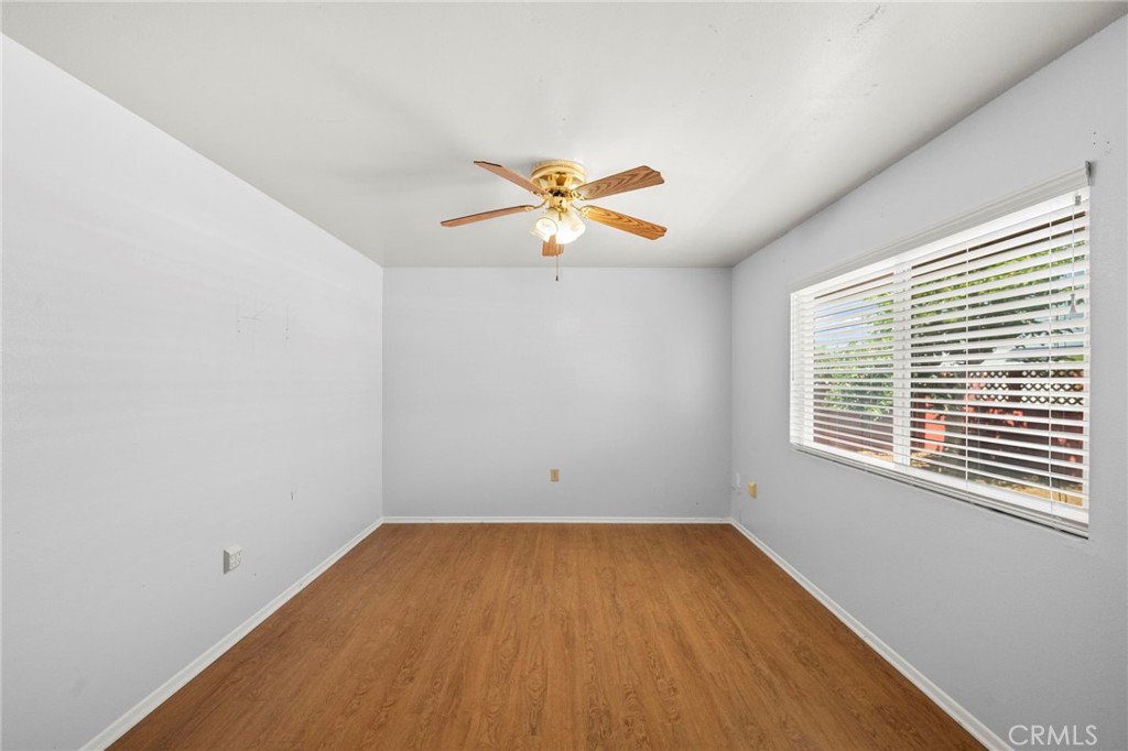 25915 Roanoke Road Menifee, CA 92586 - Photo 38 of 58 wooden floor in an empty room with a window