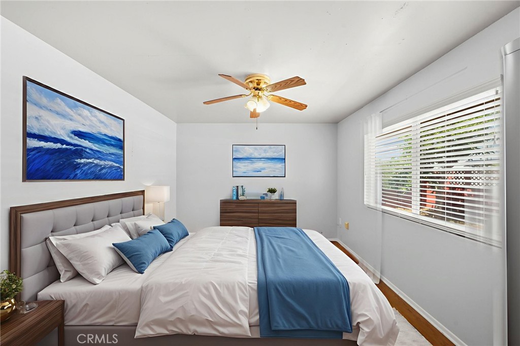 25915 Roanoke Road Menifee, CA 92586 - Photo 39 of 58 a bedroom with a large bed and a window