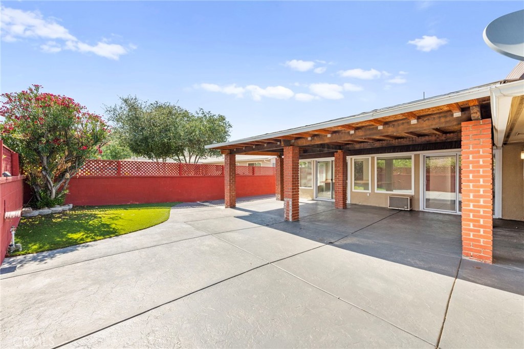 25915 Roanoke Road Menifee, CA 92586 - Photo 44 of 58 a front view of a house with a yard and garage