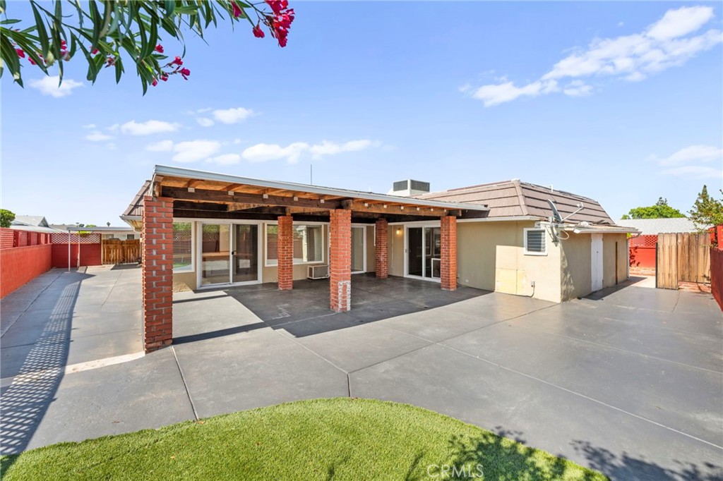 25915 Roanoke Road Menifee, CA 92586 - Photo 45 of 58 a front view of a house with a yard and garage