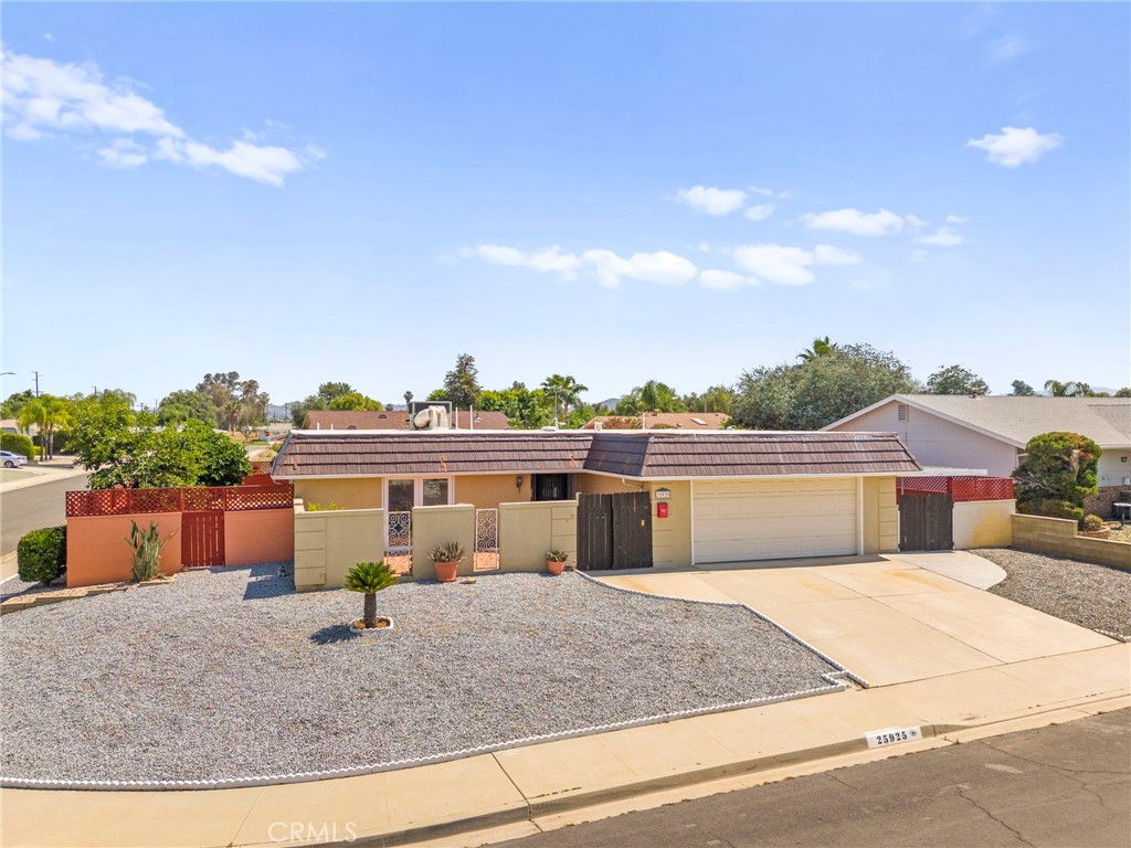 25915 Roanoke Road Menifee, CA 92586 - Photo 49 of 58 a view of a house with a backyard