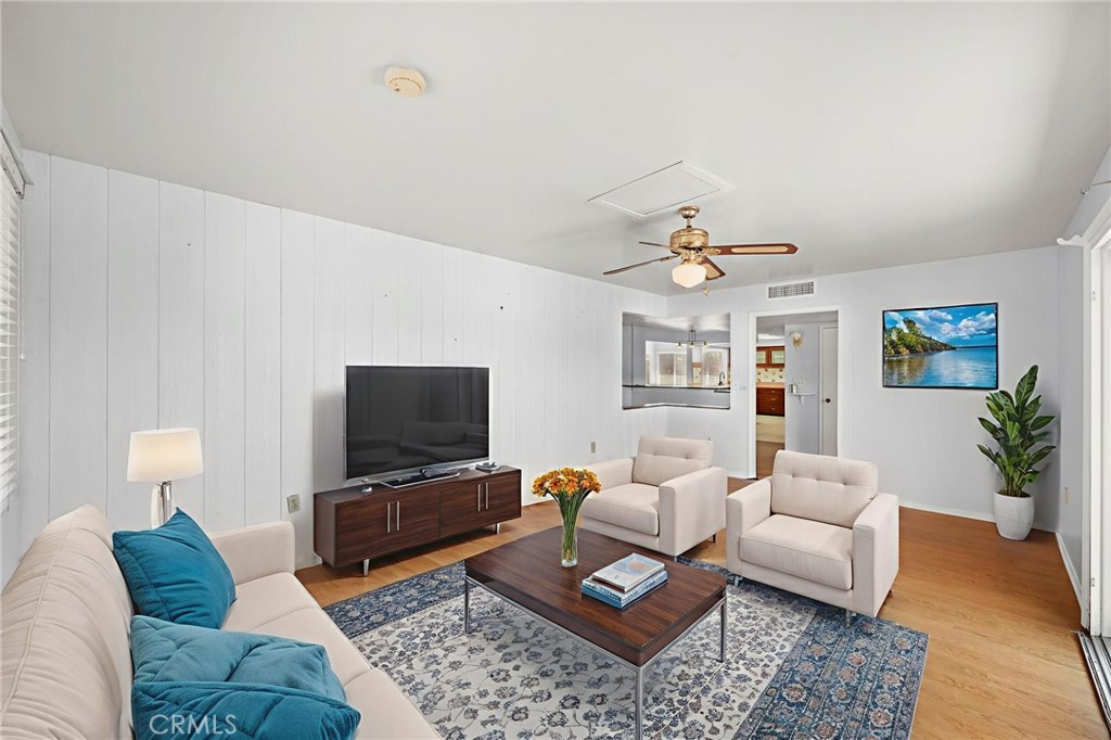 25915 Roanoke Road Menifee, CA 92586 - Photo 5 of 58 a living room with furniture and a flat screen tv