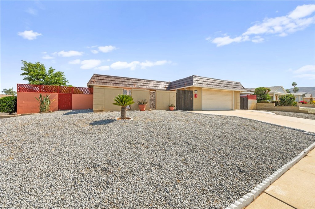 25915 Roanoke Road Menifee, CA 92586 - Photo 53 of 58 a front view of a house with garden