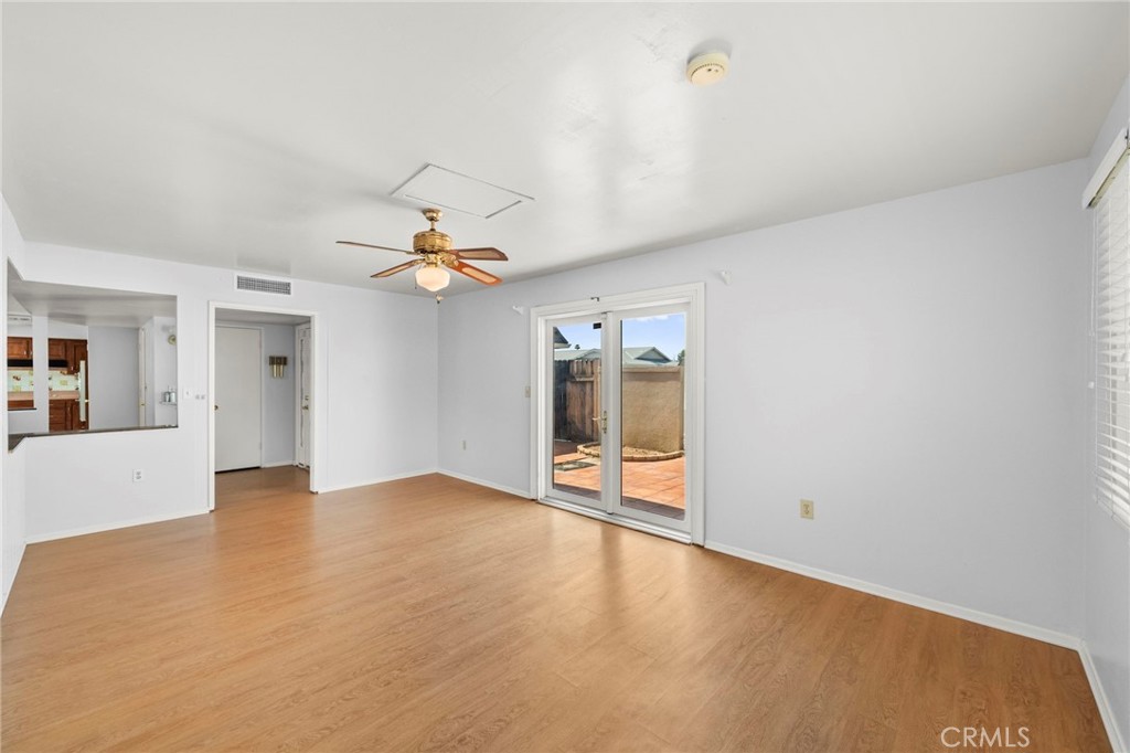 25915 Roanoke Road Menifee, CA 92586 - Photo 6 of 58 wooden floor in an empty room with a window