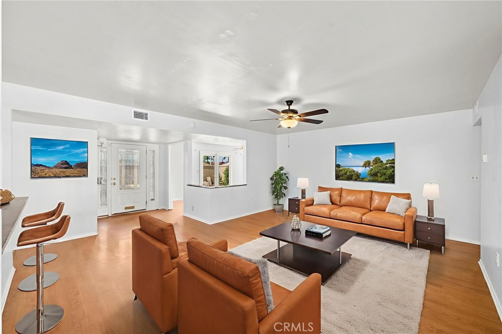 25915 Roanoke Road Menifee, CA 92586 - Photo 10 of 58 a living room with furniture and a flat screen tv