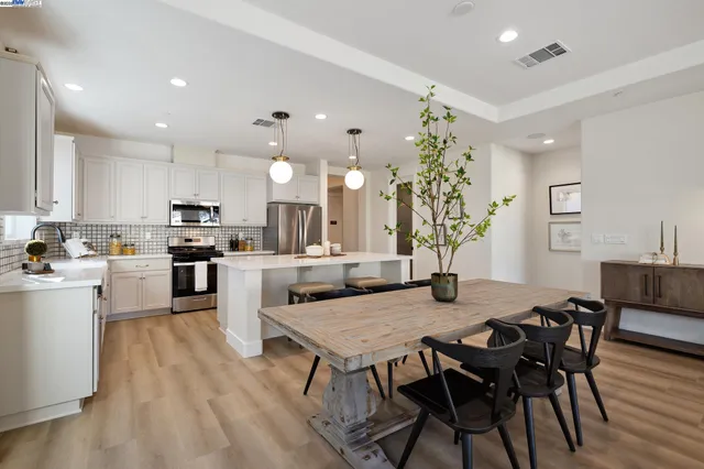 a kitchen with a table and chairs in it