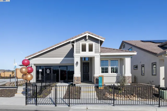 a front view of a house with glass windows