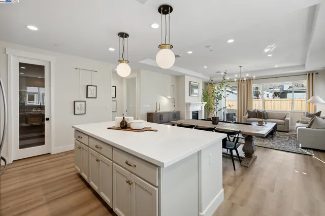 an open kitchen with a table and chairs