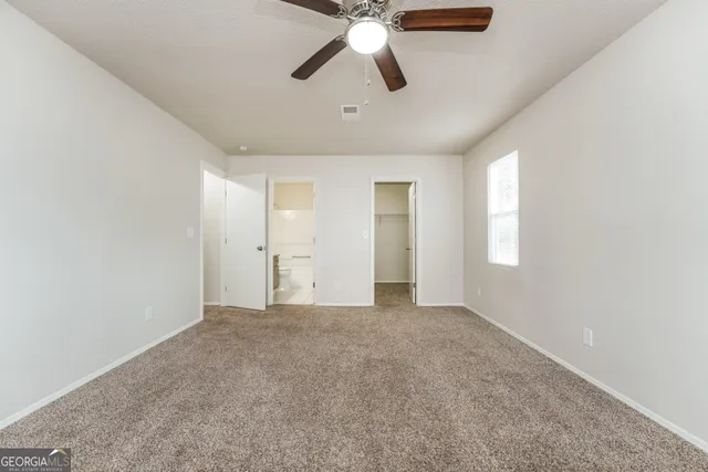 a view of an empty room and window
