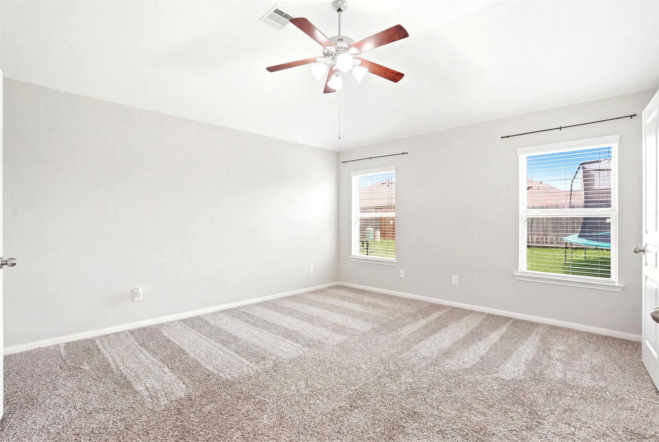 3718 Logandale Ridge Lane Katy, TX 77493 - Photo 17 of 28 High ceilings and view of backyard from primary suite