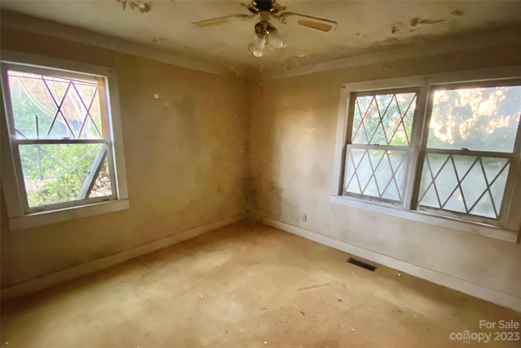793 Silver Creek Road Mill Spring, NC 28756 - Photo 18 of 20 a view of an empty room with a window