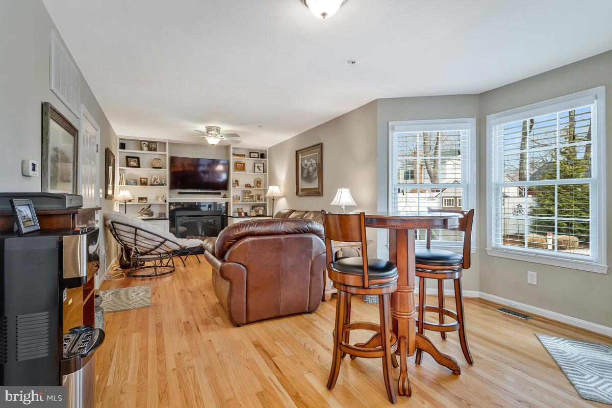 1713 Shore Drive Edgewater, MD 21037 - Photo 14 of 44 a living room with fireplace furniture and a flat screen tv