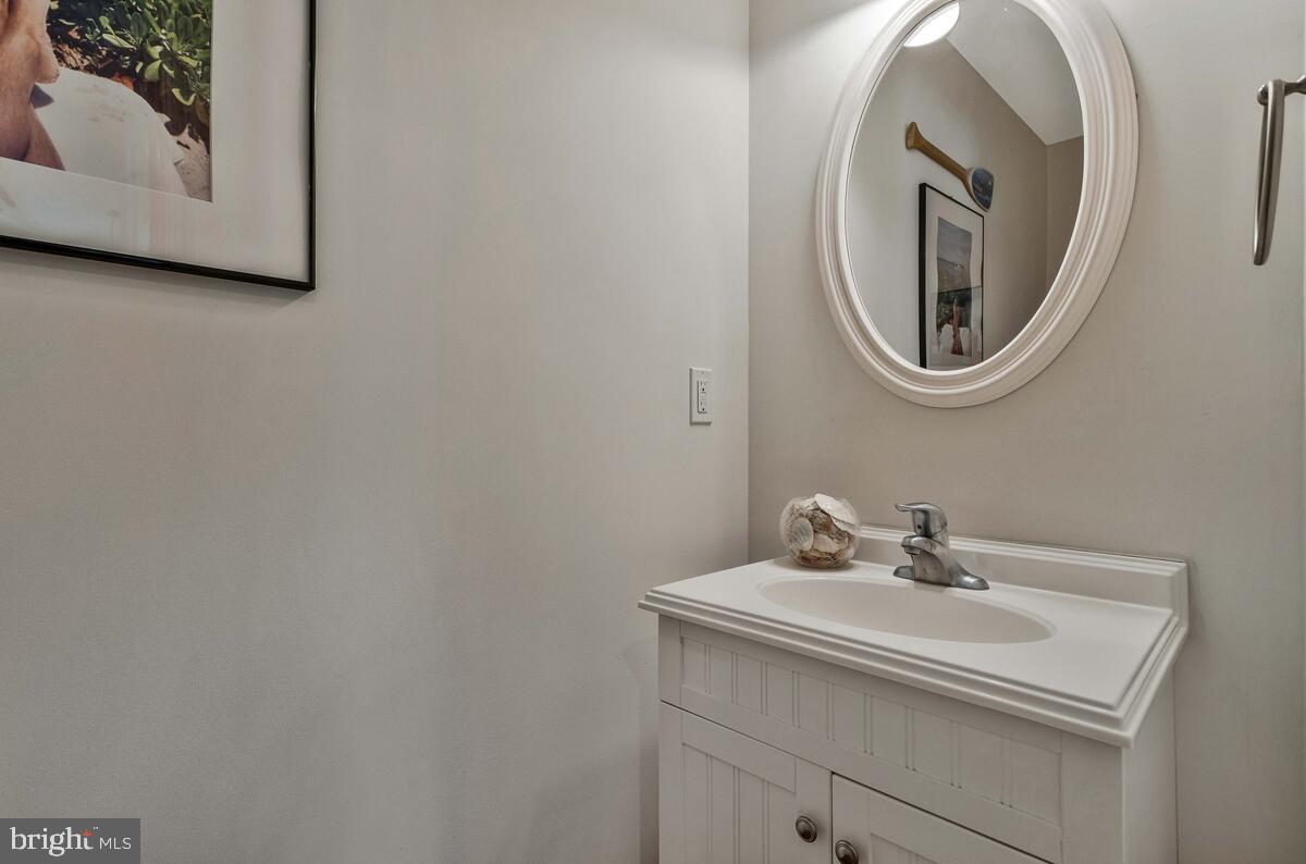 1713 Shore Drive Edgewater, MD 21037 - Photo 16 of 44 a bathroom with a sink and a mirror