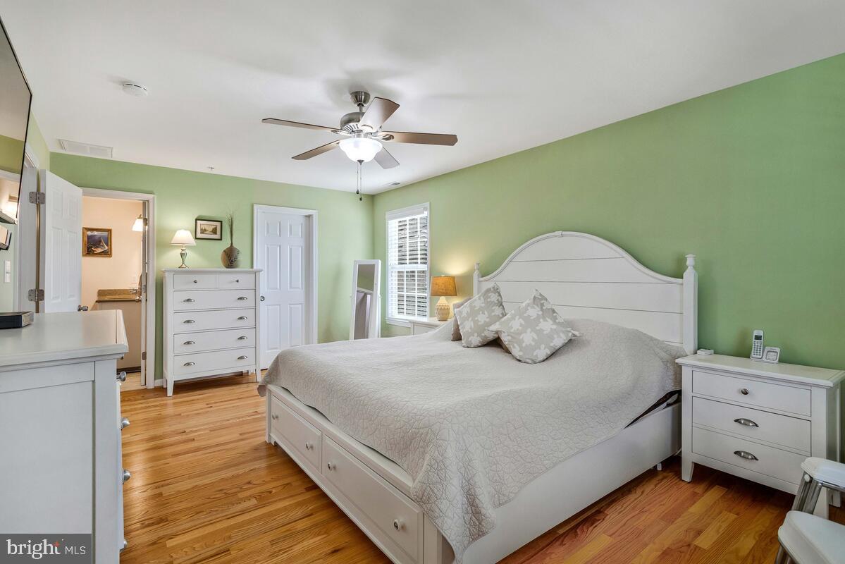 1713 Shore Drive Edgewater, MD 21037 - Photo 17 of 44 a spacious bedroom with a bed and a dresser
