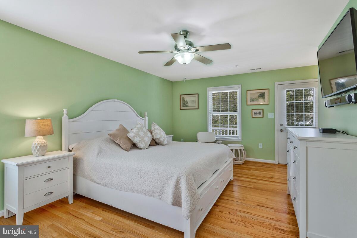 1713 Shore Drive Edgewater, MD 21037 - Photo 18 of 44 a bedroom with a large bed and a chandelier