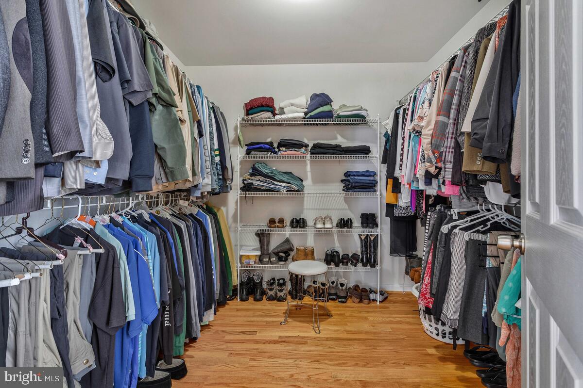 1713 Shore Drive Edgewater, MD 21037 - Photo 24 of 44 a view of walk in closet with clothes and shoes