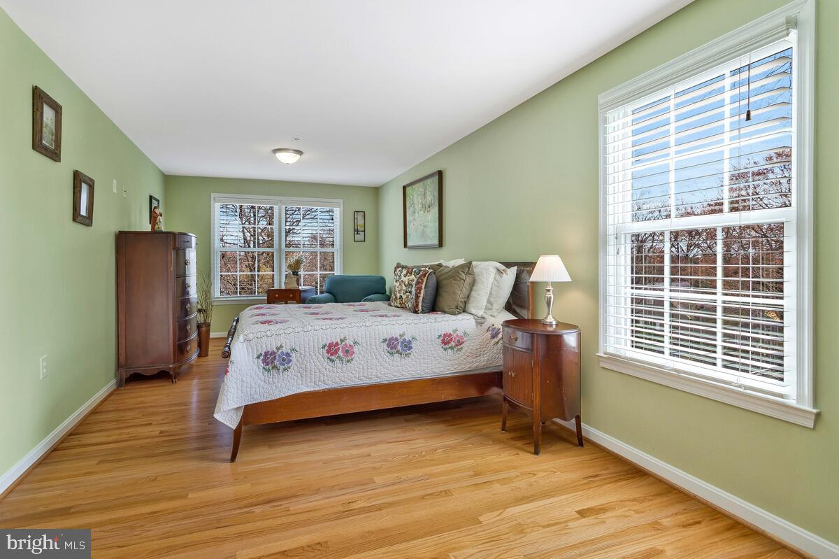1713 Shore Drive Edgewater, MD 21037 - Photo 31 of 44 a bedroom with a bed wooden floor and window