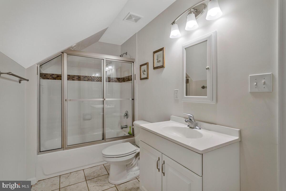 1713 Shore Drive Edgewater, MD 21037 - Photo 35 of 44 a bathroom with a toilet sink shower and mirror