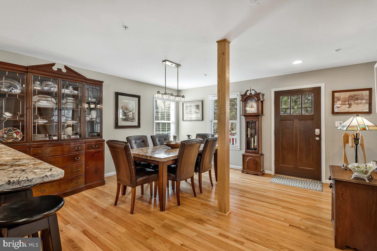 1713 Shore Drive Edgewater, MD 21037 - Photo 7 of 44 a view of a dining room with furniture and wooden floor