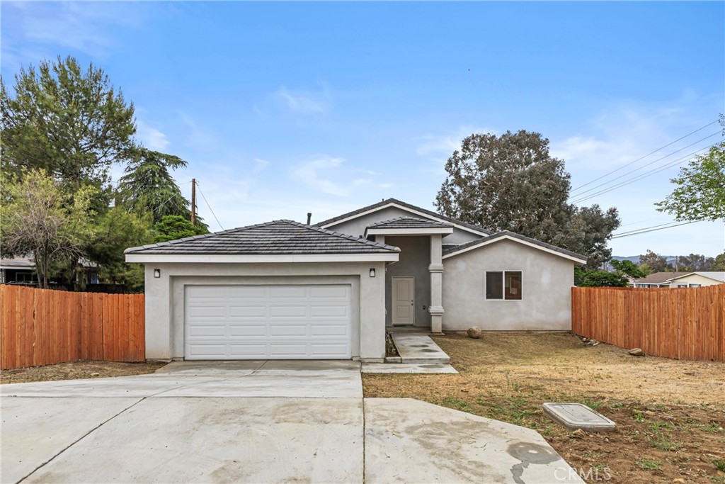 230 East Hoffer Street Banning, CA 92220 - Photo 24 of 32 a front view of a house with a garage