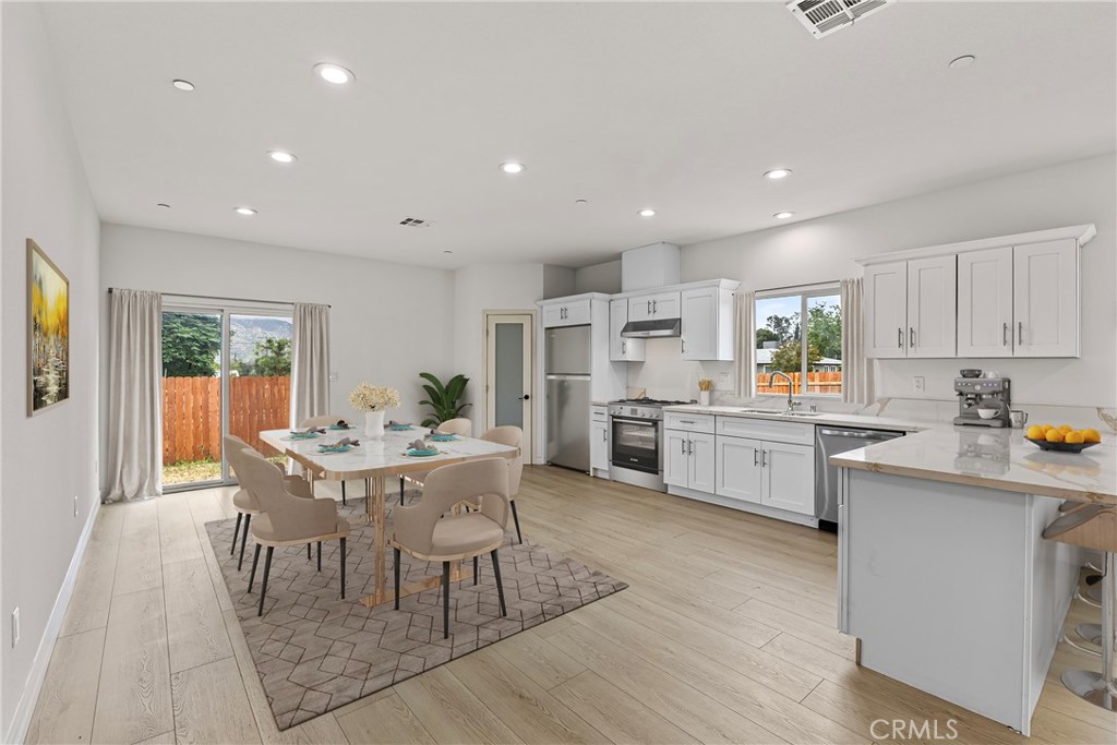 230 East Hoffer Street Banning, CA 92220 - Photo 3 of 32 a kitchen with white cabinets and counter space