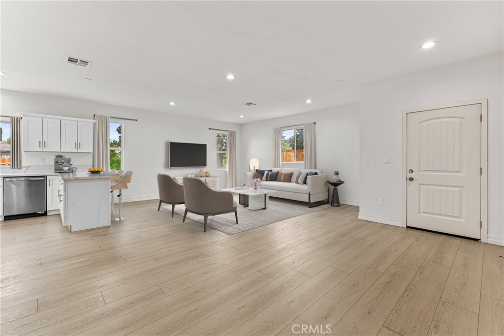 230 East Hoffer Street Banning, CA 92220 - Photo 5 of 32 a living room with furniture and a wooden floor
