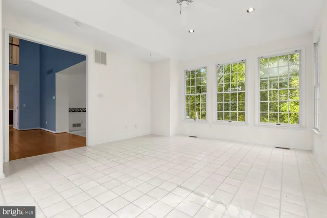 a view of kitchen with furniture and wooden floor