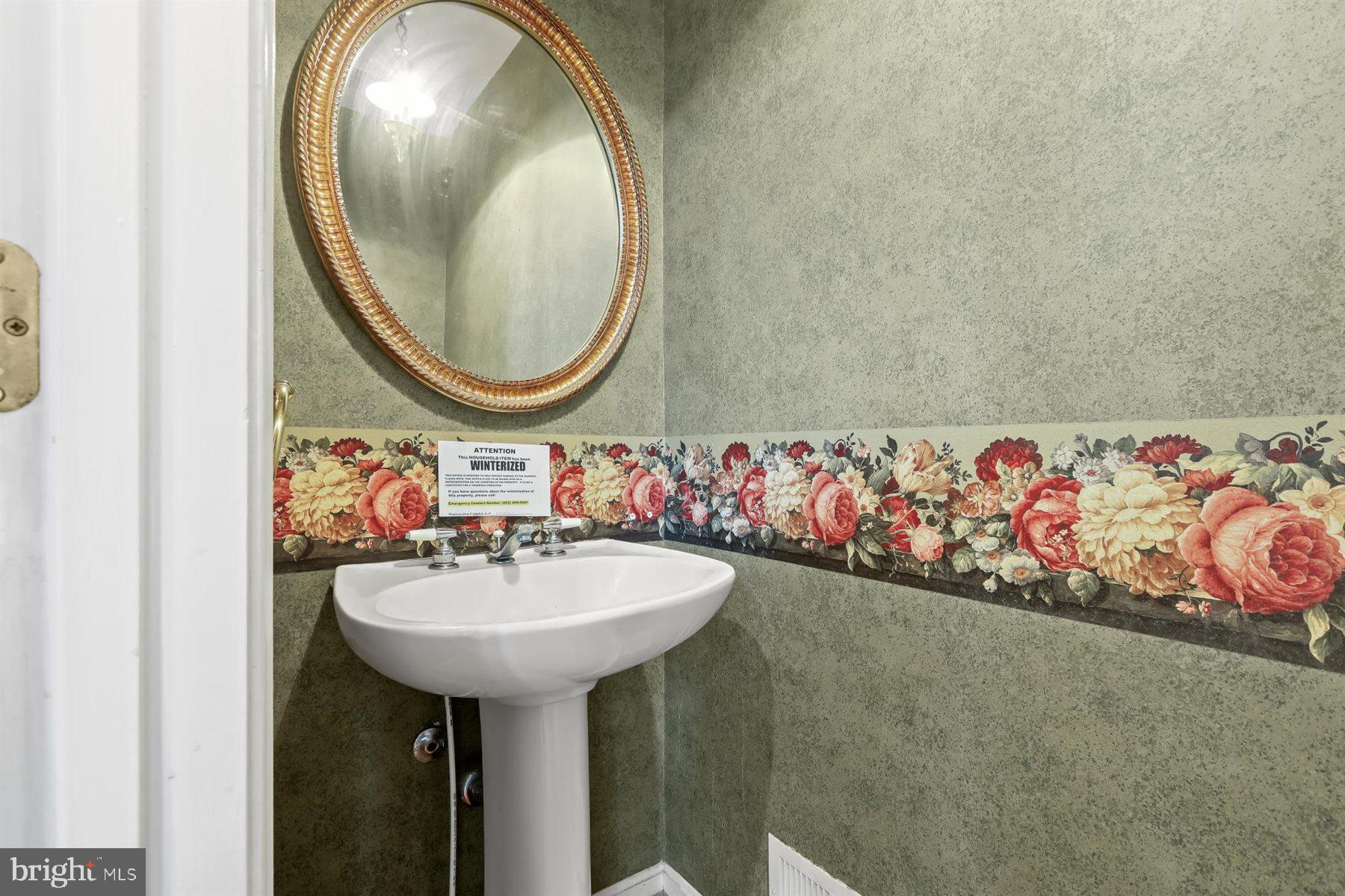 3360 Lawndale Road Reisterstown, MD 21136 - Photo 14 of 63 a bathroom with a sink and a mirror