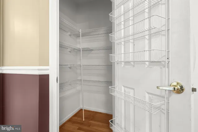 a view of a yard with wooden fence