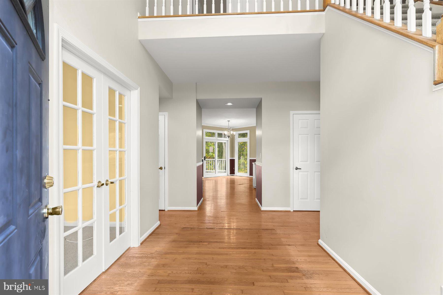 3360 Lawndale Road Reisterstown, MD 21136 - Photo 2 of 63 a view of a hallway with wooden floor and windows