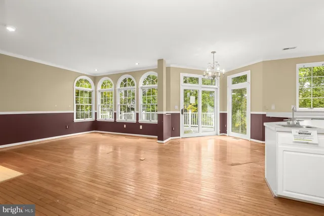 a view of an entryway with wooden floor