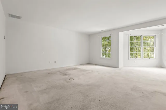 a bathroom with a bathtub a sink a mirror a window and a shower