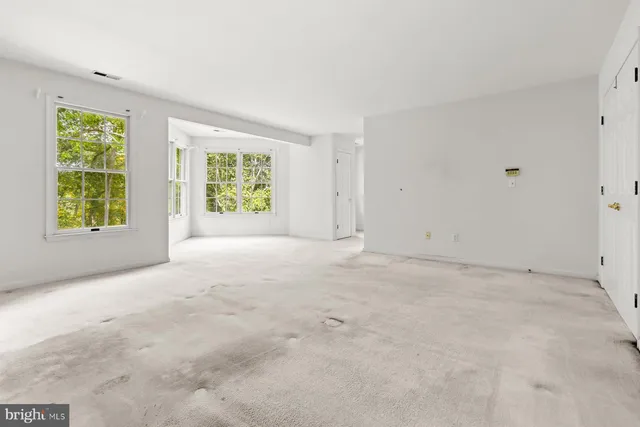 a bathroom with a double vanity sink mirror and shower