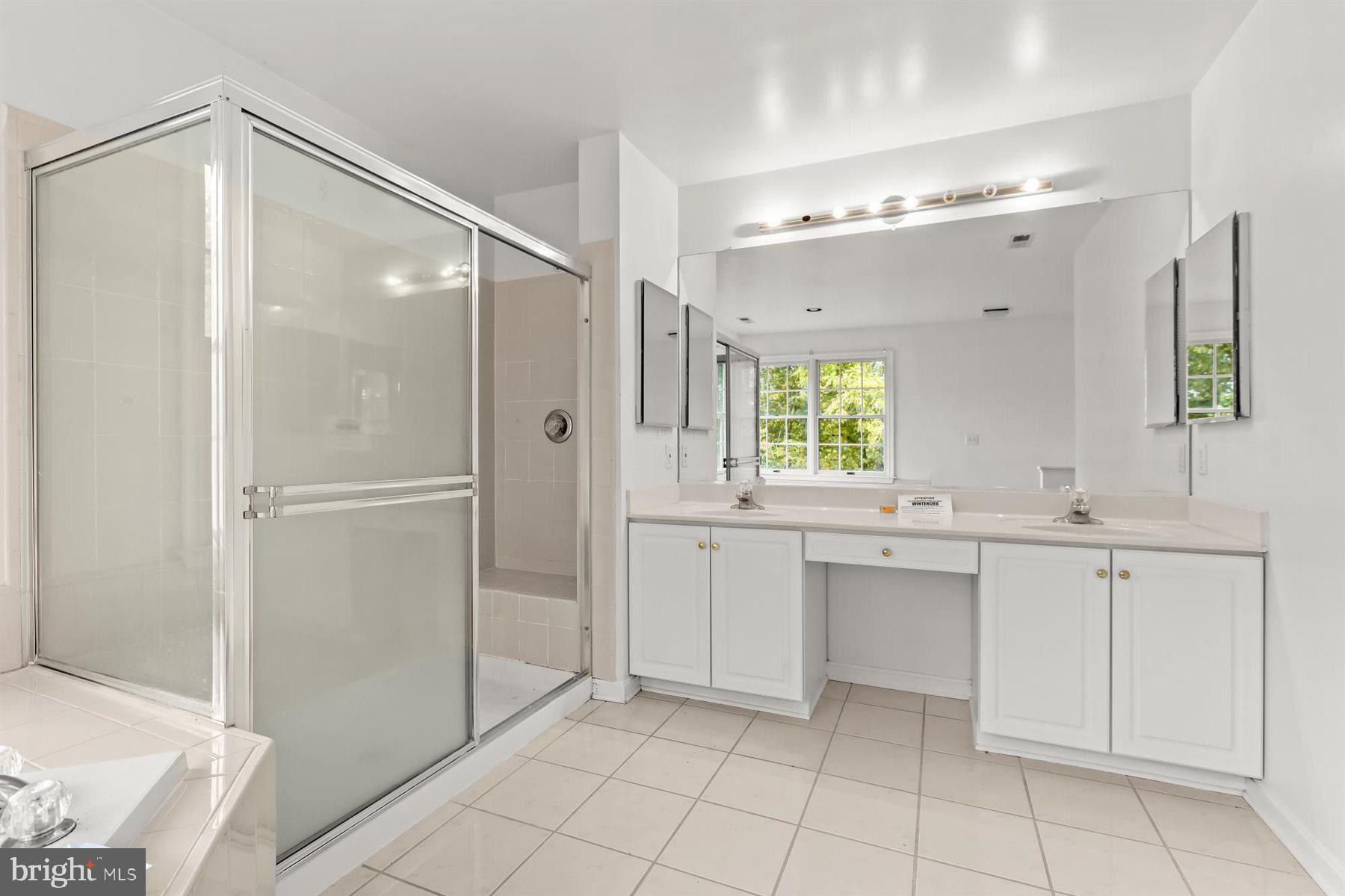 3360 Lawndale Road Reisterstown, MD 21136 - Photo 39 of 63 a bathroom with a double vanity sink mirror and shower