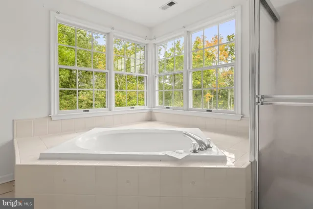 a view of an empty room with wooden walls