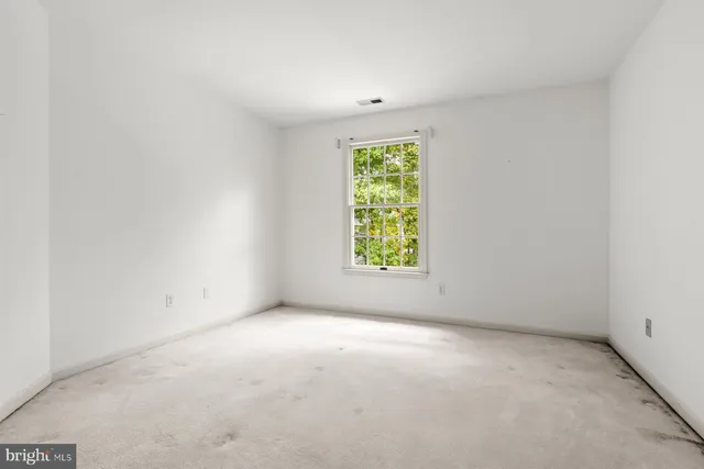 a picture of a room with a refrigerator