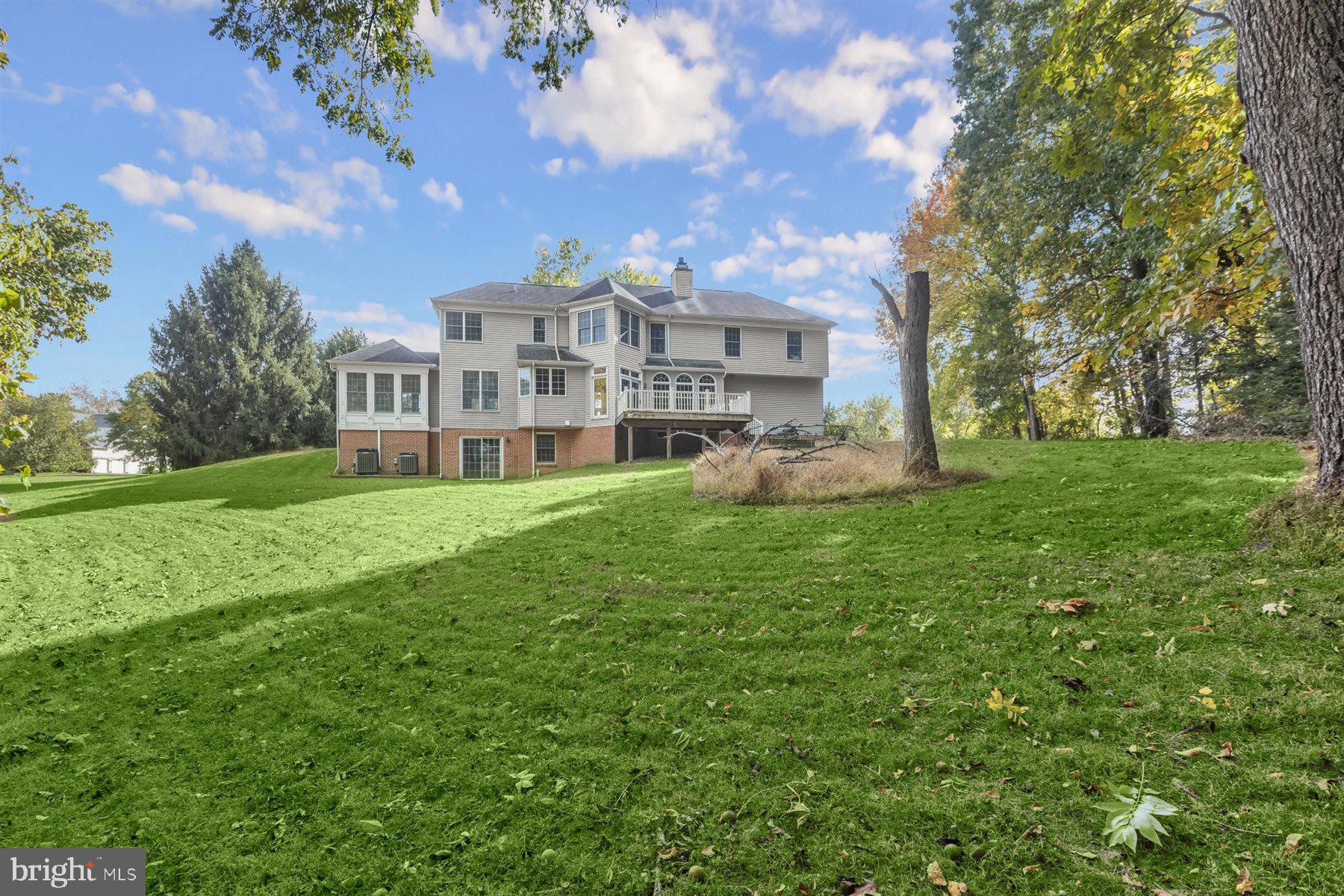 3360 Lawndale Road Reisterstown, MD 21136 - Photo 58 of 63 a view of a house with a big yard and large trees
