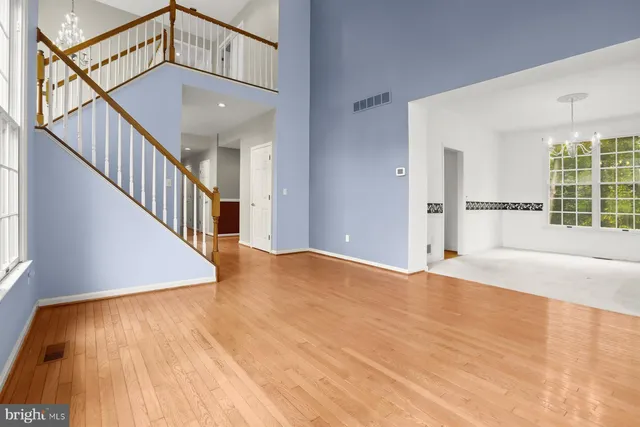 a view of an entryway with wooden floor