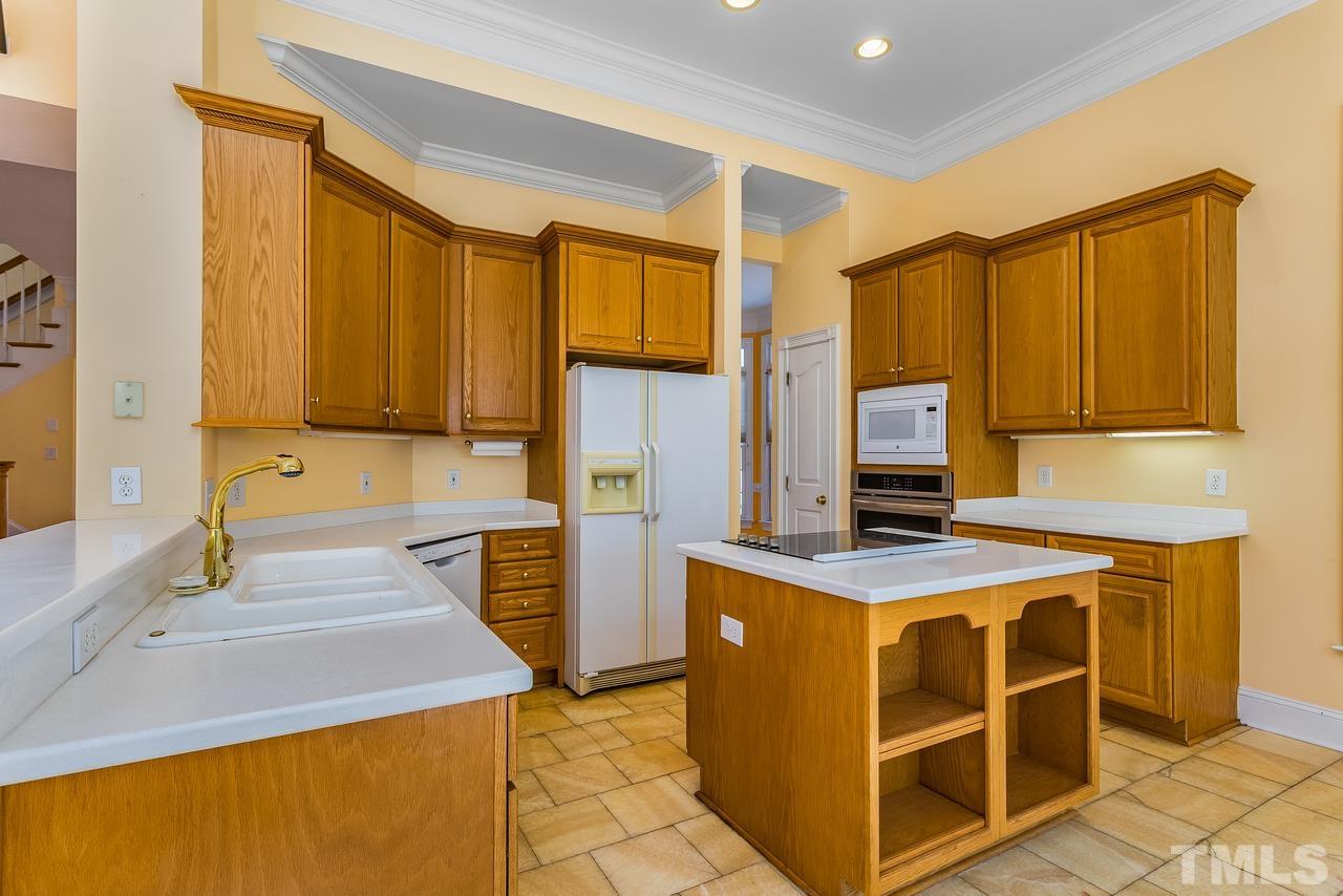 3117 Bentley Hill Road Raleigh, NC 27612 - Photo 14 of 27 Island with cooktop. Marble floors