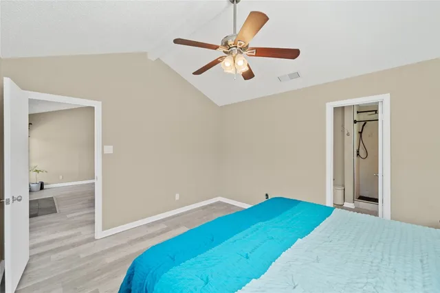 a bathroom with a granite countertop shower and a sink