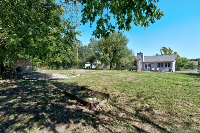 a view of outdoor space with deck and yard