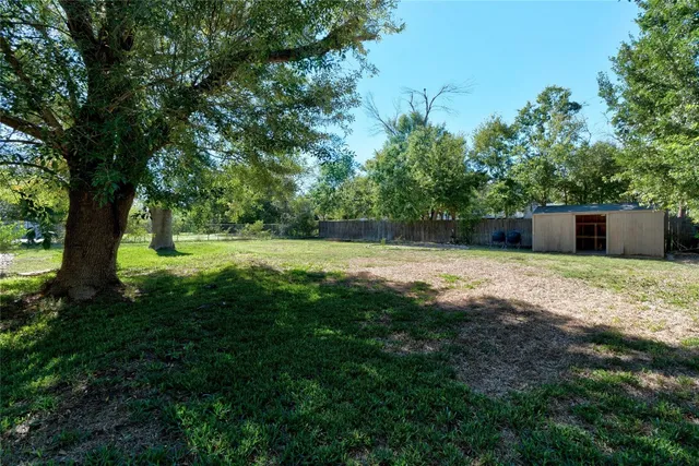 a view of a house with backyard sitting area and porch