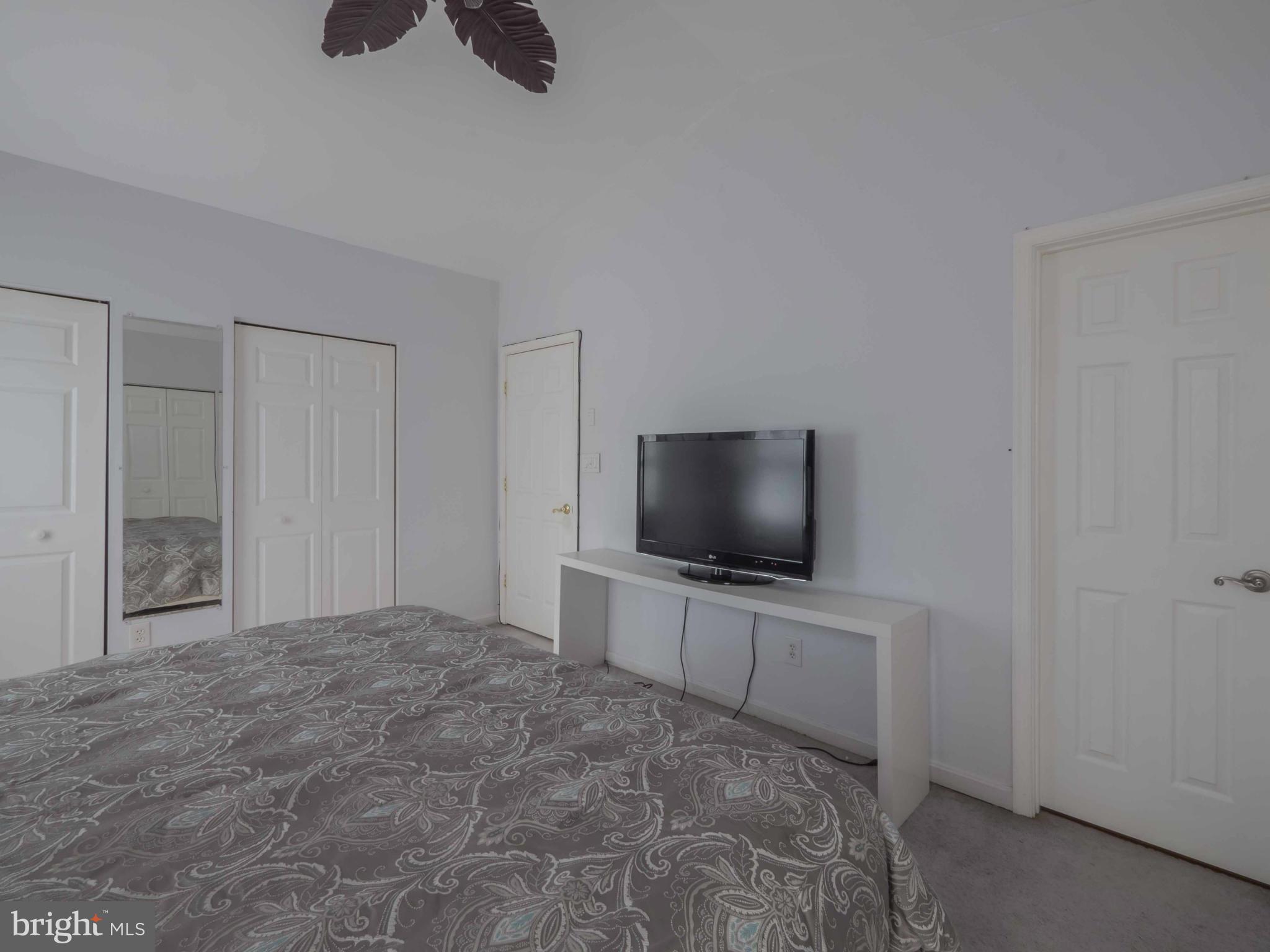 413 Salisbury Road Edgewater, MD 21037 - Photo 13 of 30 a room with a flat screen tv and a dresser