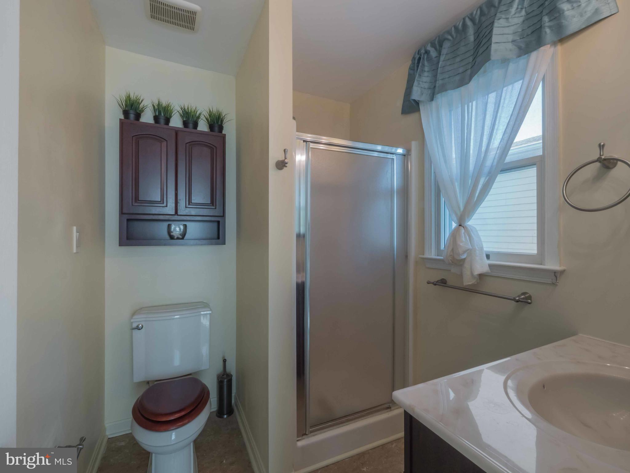 413 Salisbury Road Edgewater, MD 21037 - Photo 14 of 30 a bathroom with a sink and toilet