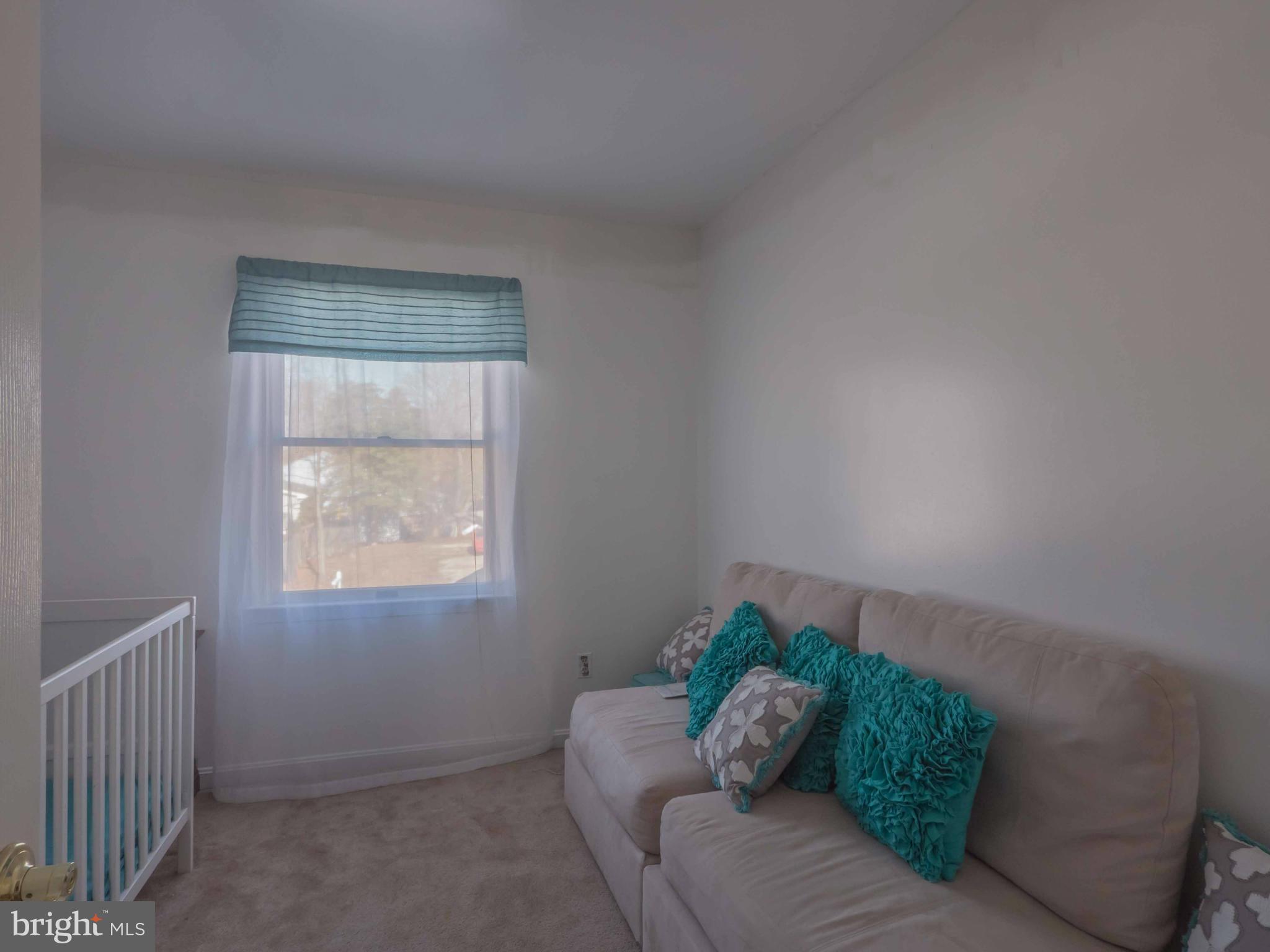 413 Salisbury Road Edgewater, MD 21037 - Photo 17 of 30 a living room with furniture and a window