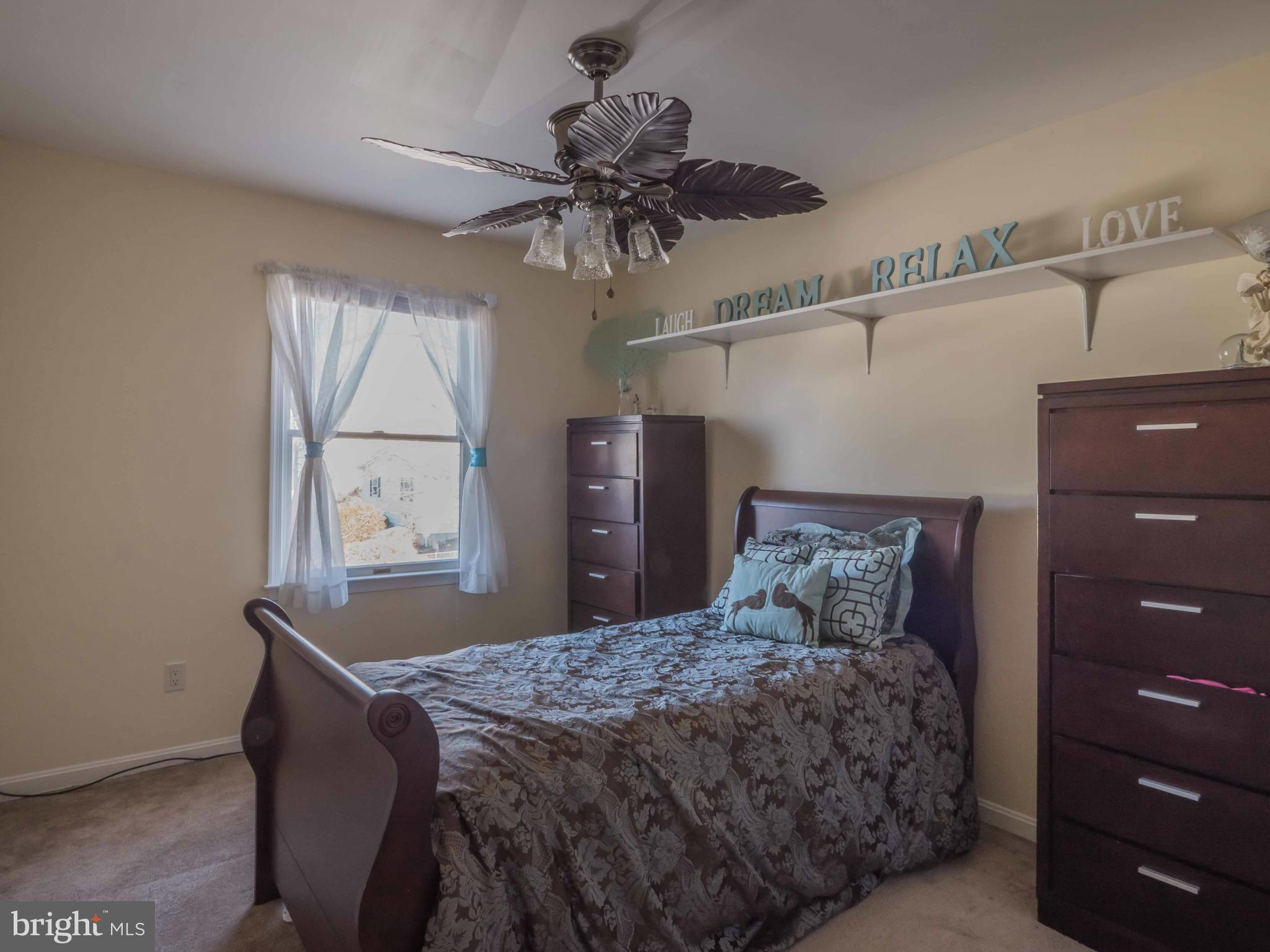 413 Salisbury Road Edgewater, MD 21037 - Photo 19 of 30 a bedroom with a bed and a window