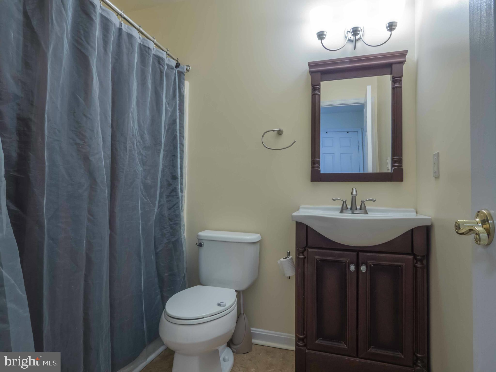 413 Salisbury Road Edgewater, MD 21037 - Photo 22 of 30 a bathroom with a toilet sink and mirror