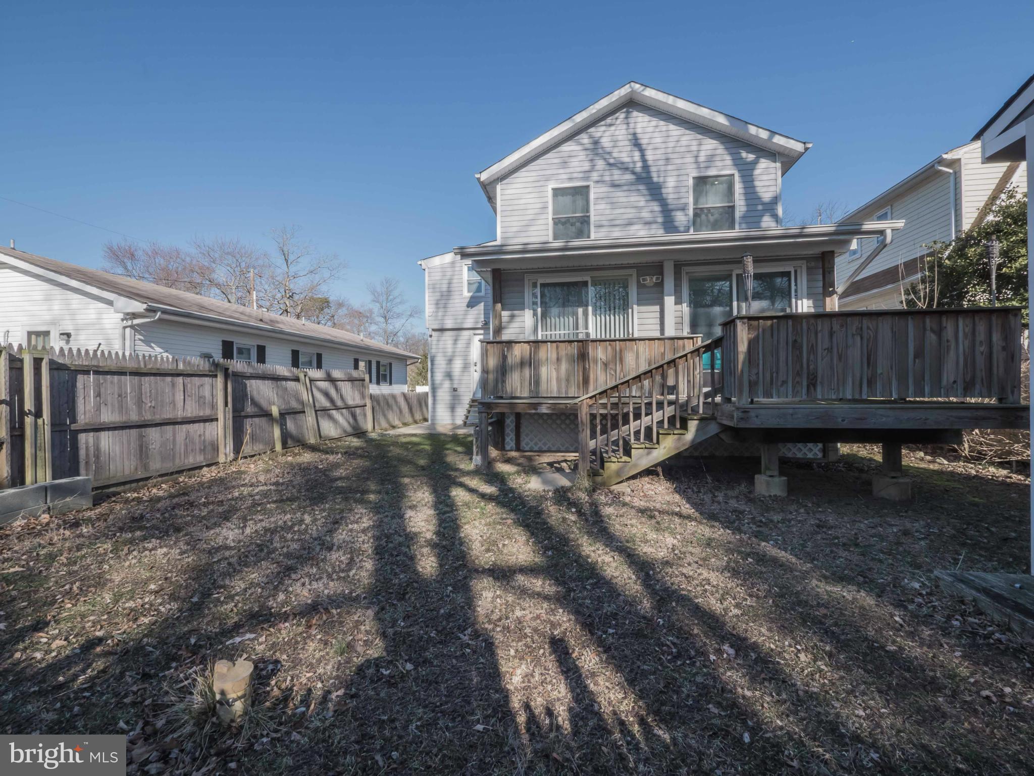413 Salisbury Road Edgewater, MD 21037 - Photo 24 of 30 a view of house with wooden deck and a small yard
